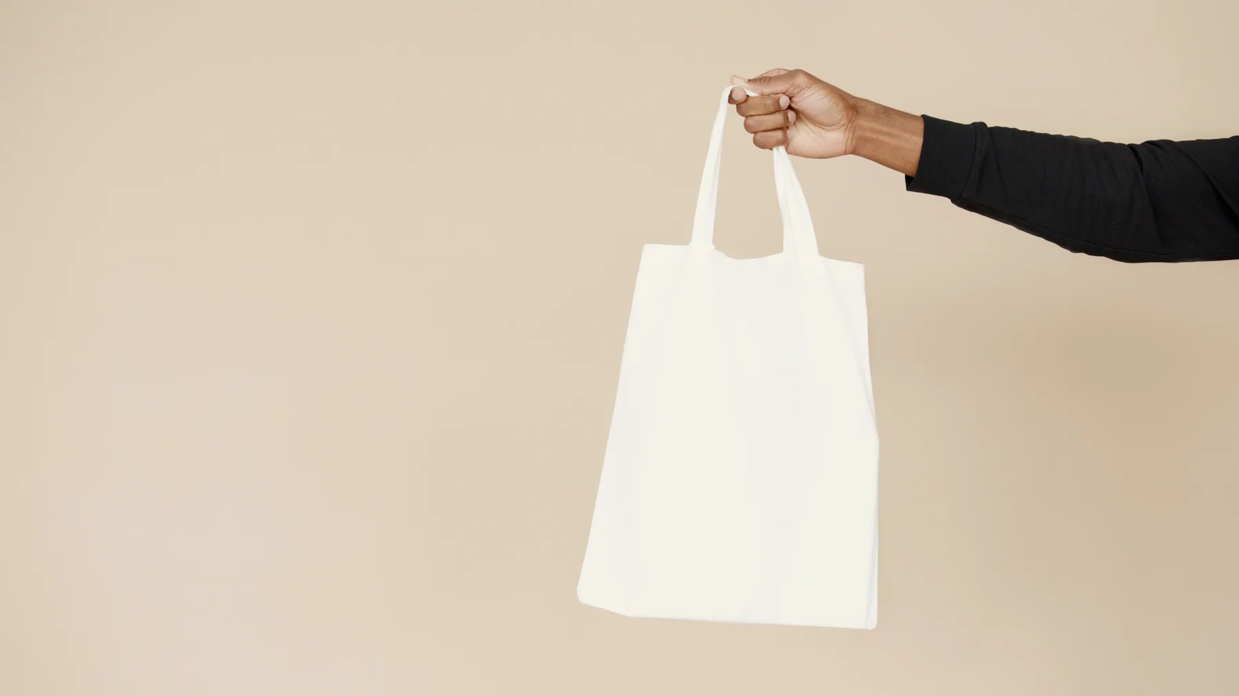 Minimal lifestyle image with a plain tote bag
